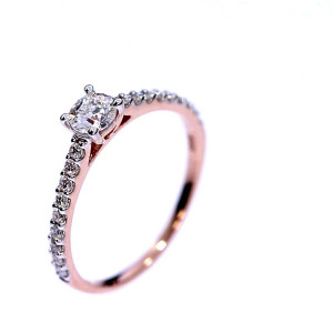 Golden ring with precious stones