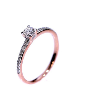 Golden ring with precious stones