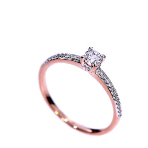 Golden ring with precious stones