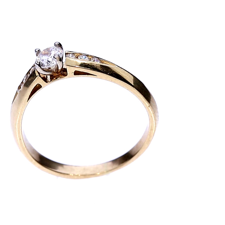 Golden ring with zircon