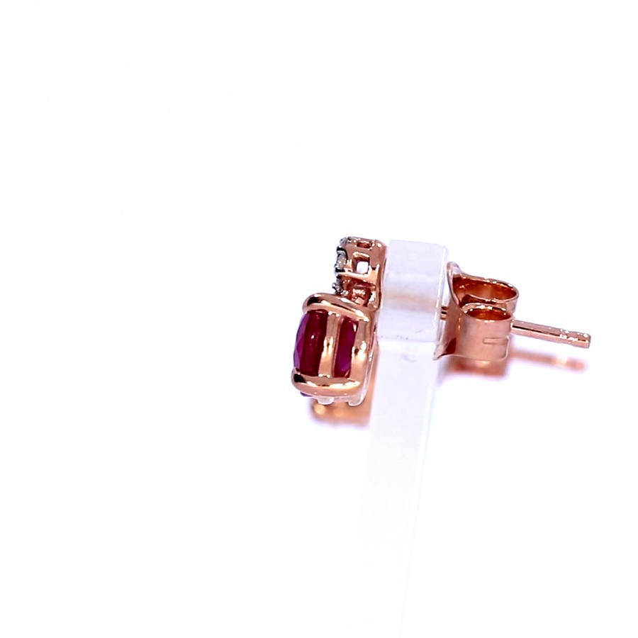 Golden earrings with precious stones