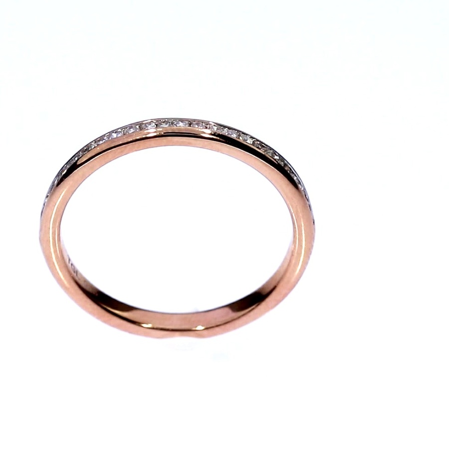 Golden ring with precious stones